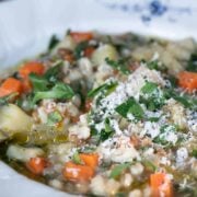 Close up view of lentil and barley soup in a bowl.