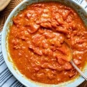 Overhead shot of a bowl of pizza sauce made with cherry tomatoes.