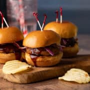 Ground turkey sliders on a wooden cutting board.