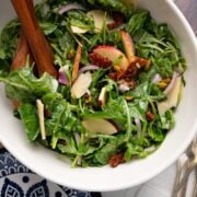Salad with arugula and spinach in a large bowl.