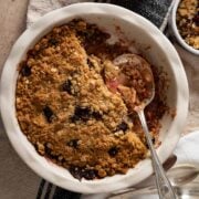 A pie plate with the baked cherry apple crisp.