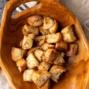 Ciabatta croutons in a wooden bowl.