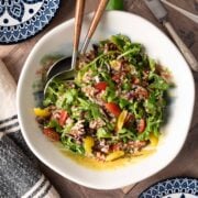 Quinoa arugula salad in a big bowl.