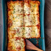 A casserole dish with a cooked lasagna Florentine.