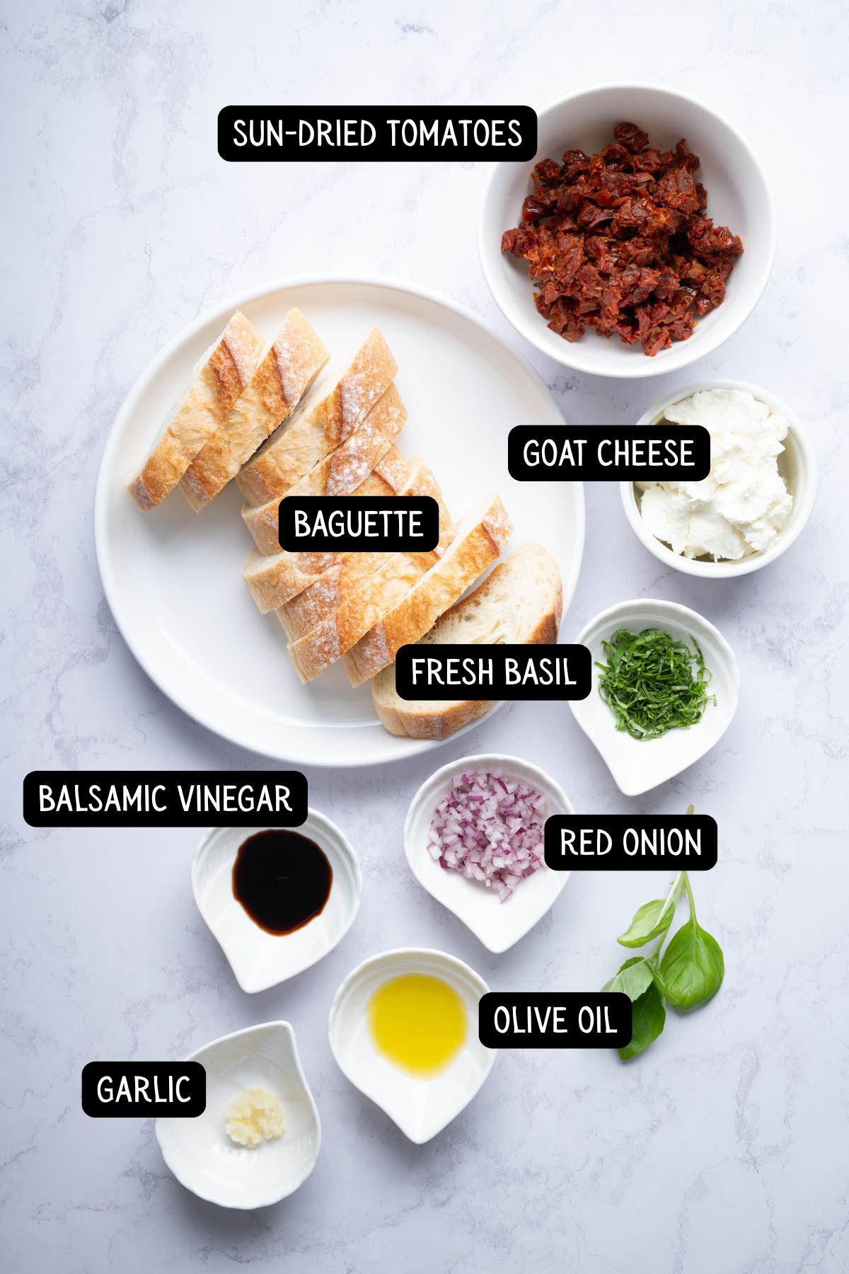 The ingredients needed to make sun-dried tomato bruschetta.