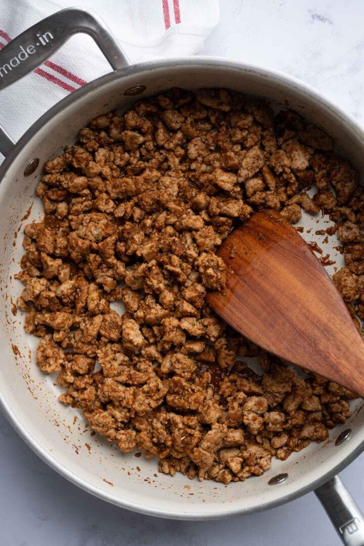 The cooked ground turkey in a skillet for ground turkey fajitas.
