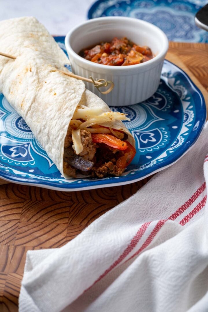 The rolled up turkey fajitas in a flour tortilla.