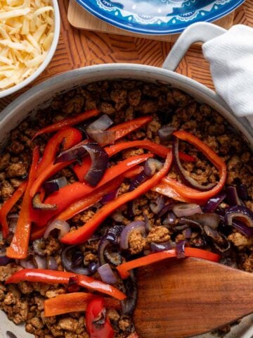 A skillet with the ground turkey fajitas mixture.
