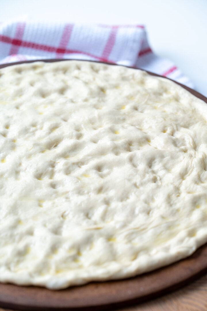 Same day pizza dough on a pizza stone.