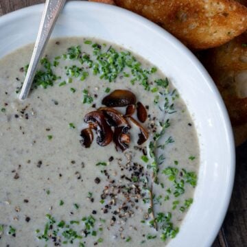A bowl of creamy mushroom and leek soup.