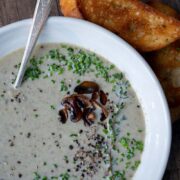 A bowl of creamy mushroom and leek soup.