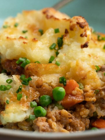 Shepherd's pie with ground pork in a bowl.