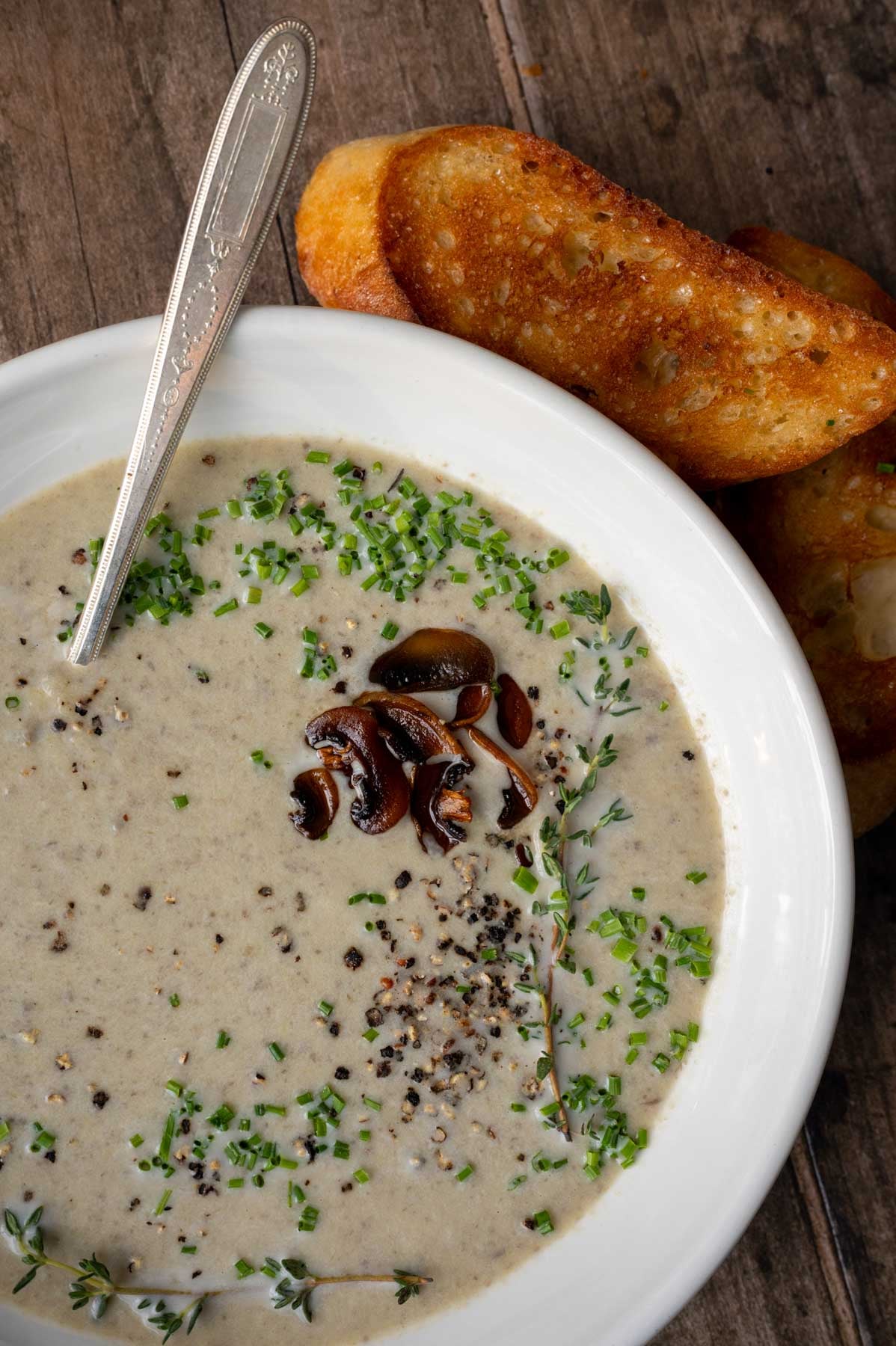 A bowl of creamy mushroom and leek soup.
