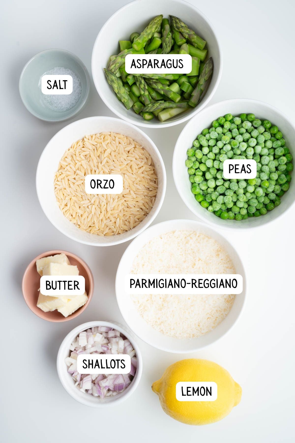 The ingredients needed to make lemony orzo with asparagus and peas.